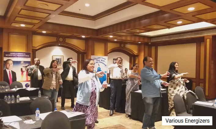 Participants energised during an interactive group activity at the Mind Power Unlimited Retreat